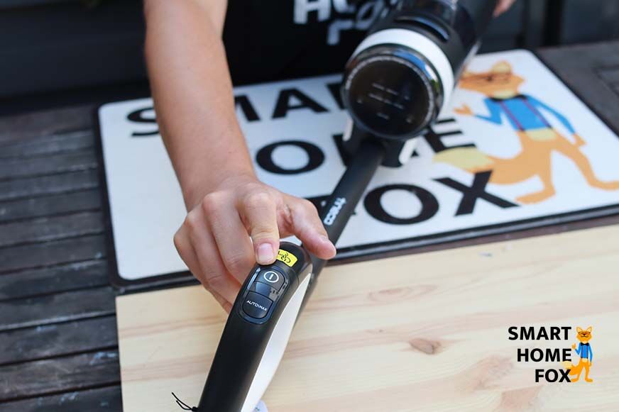 Saugmodus wählen mit Knopf am Griff